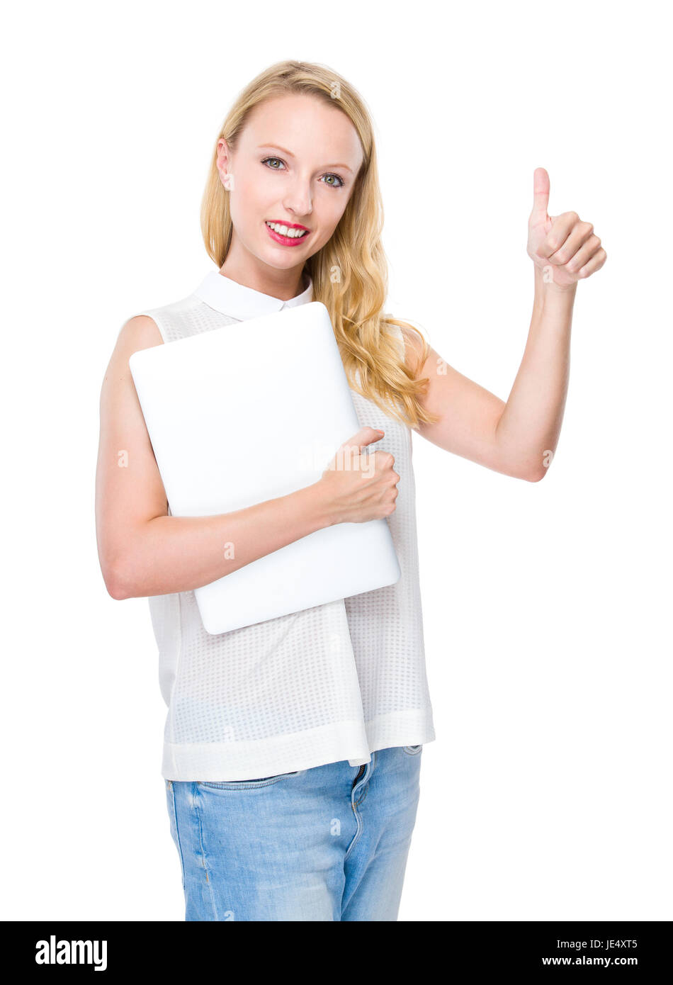 Young woman hold with laptop and thumb up Stock Photo - Alamy