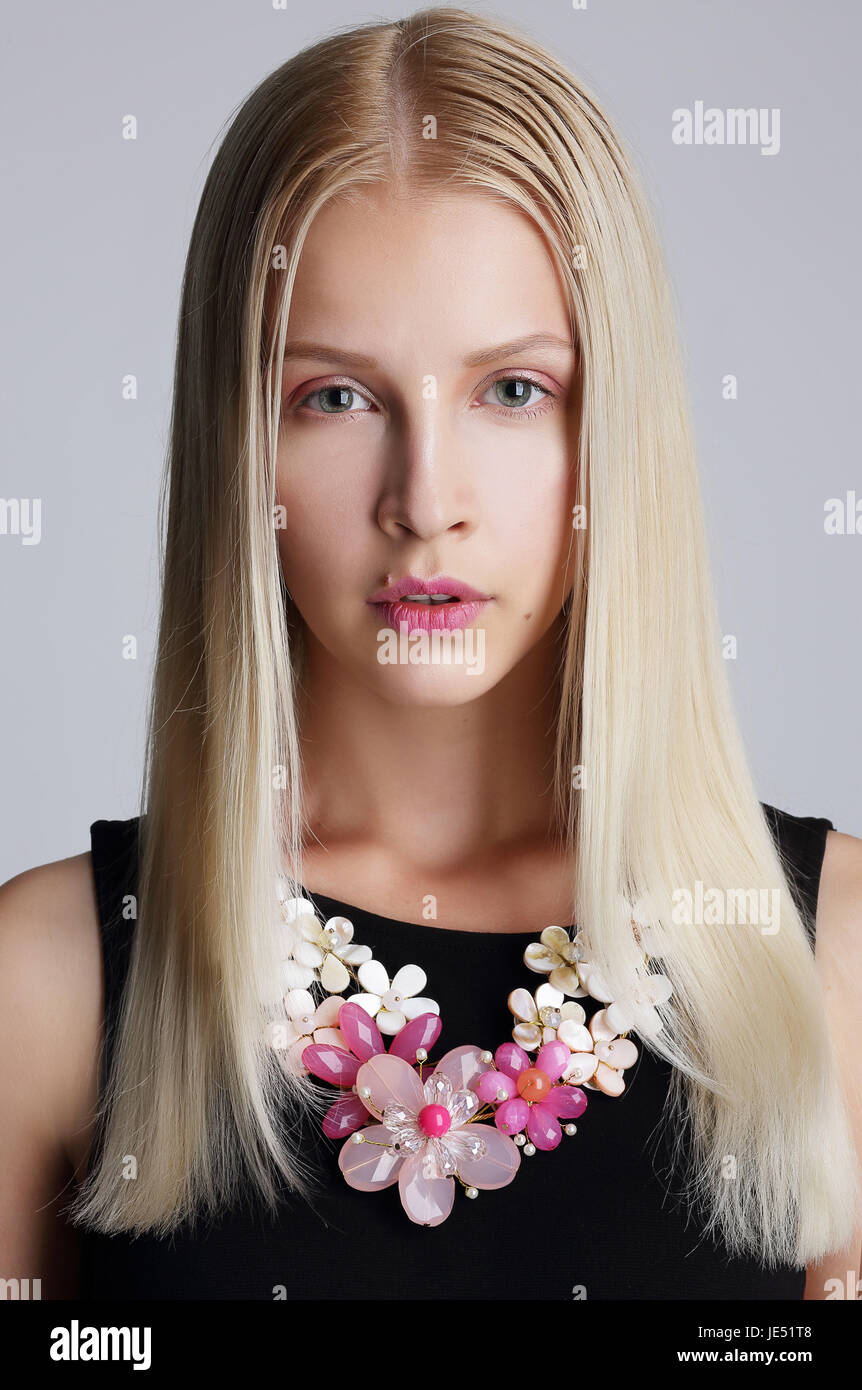 Ornamentation. Snazzy Blond Woman with Floral Necklace Stock Photo