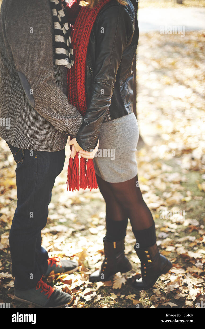 Young couple kissing in autumn park Stock Photo - Alamy
