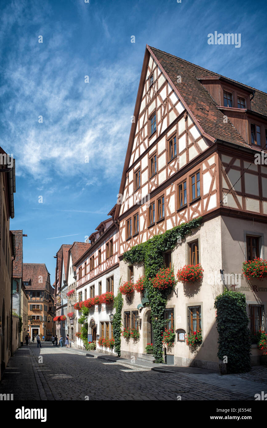 Scenic view on a street in Rothenburg ob der Tauber, Germany. The buildings are built in the 16th century. The whole city looks like this..... Stock Photo