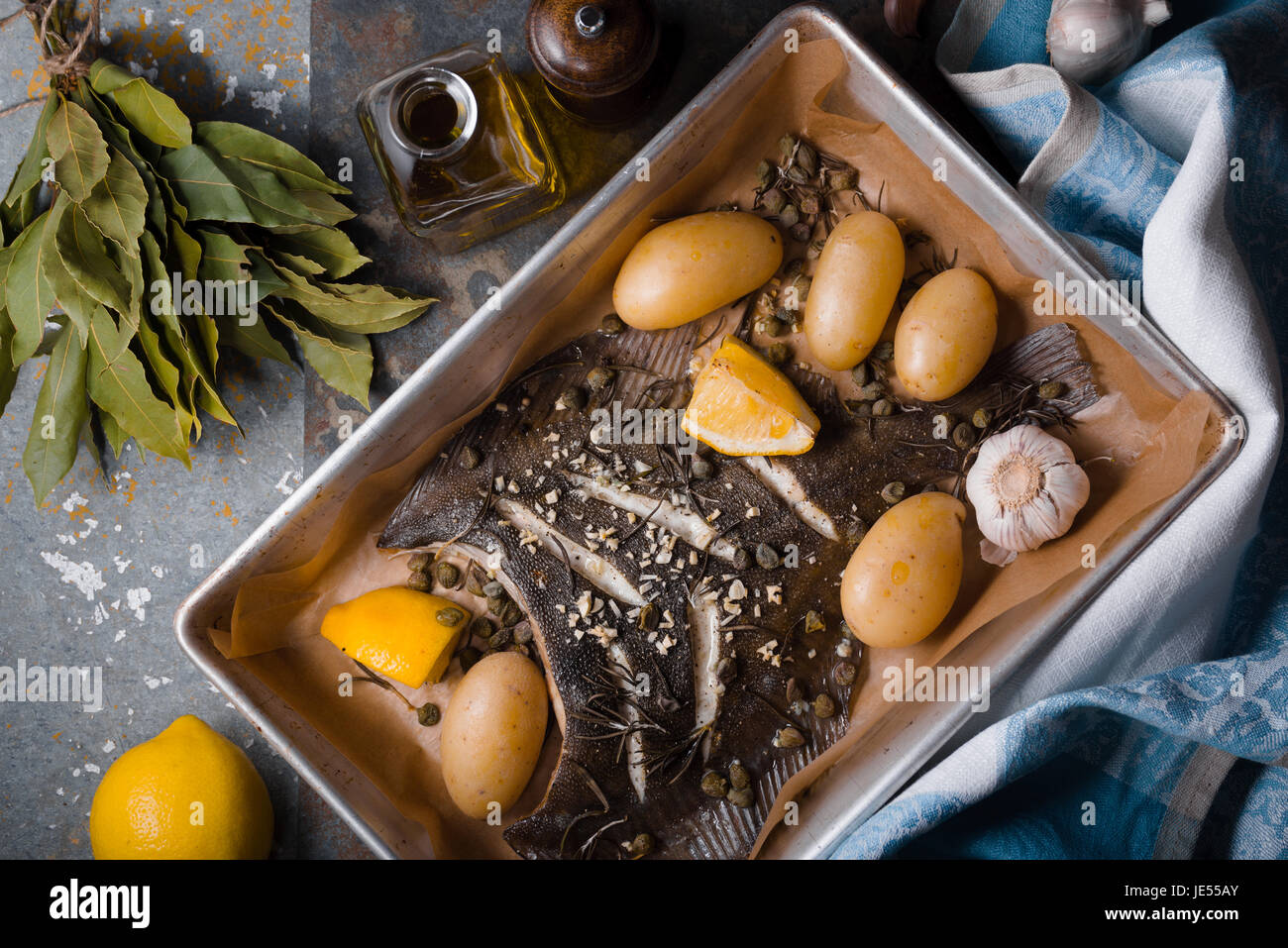 Baked flounder with potato and seasoning horizontal Stock Photo Alamy