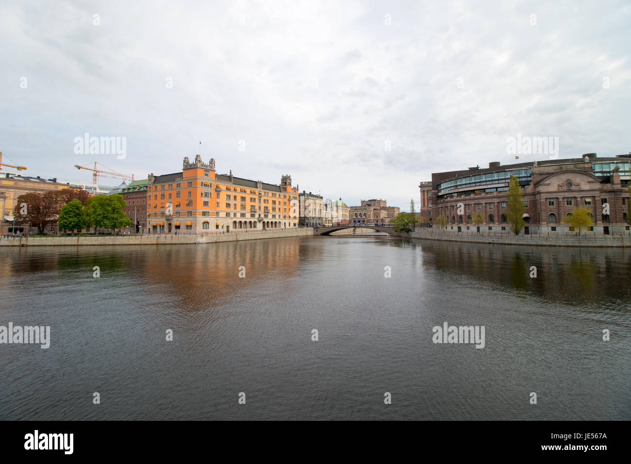 Stockholm, the capital of Sweden. The parliament building on the right side and the Goverment Office on the left side of the channel. Stock Photo