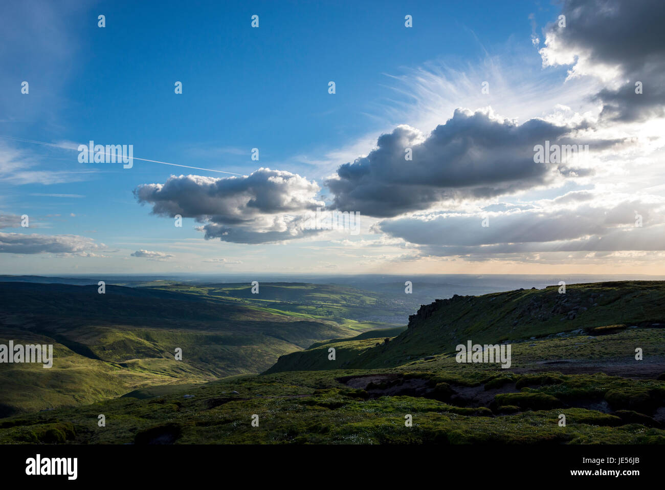 Big sky over the hills of Glossop in North Derbyshire. Manchester in the far distance. Stock Photo