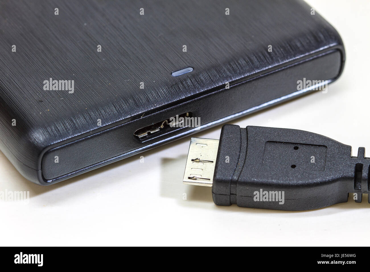 External hard drive with usb cable on white Stock Photo Alamy
