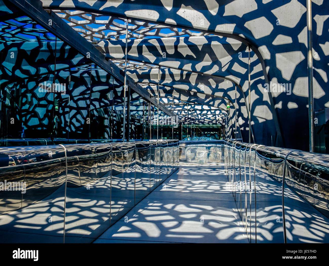 MUCEM, Marseilles, France, April 2017, corridor in a modern museum with the sunlight passing through a lattice concrete wall Stock Photo