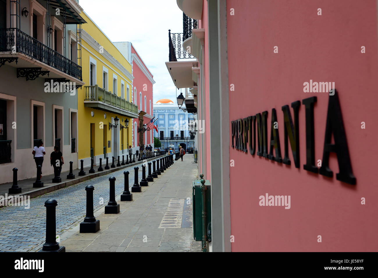 A look down a colorful street in the historical Old San Juan section of San Juan Puerto Rico Stock Photo