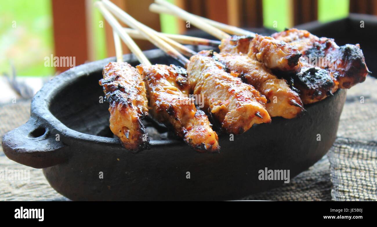 Chicken Satay Over Coconut Charcoals in Bali Stock Photo