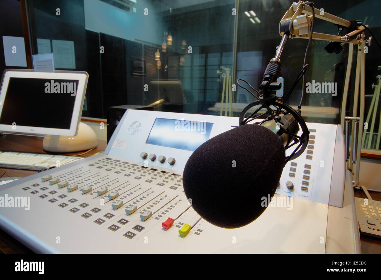 mic in front of the control panel in broadcasting studio Stock Photo ...