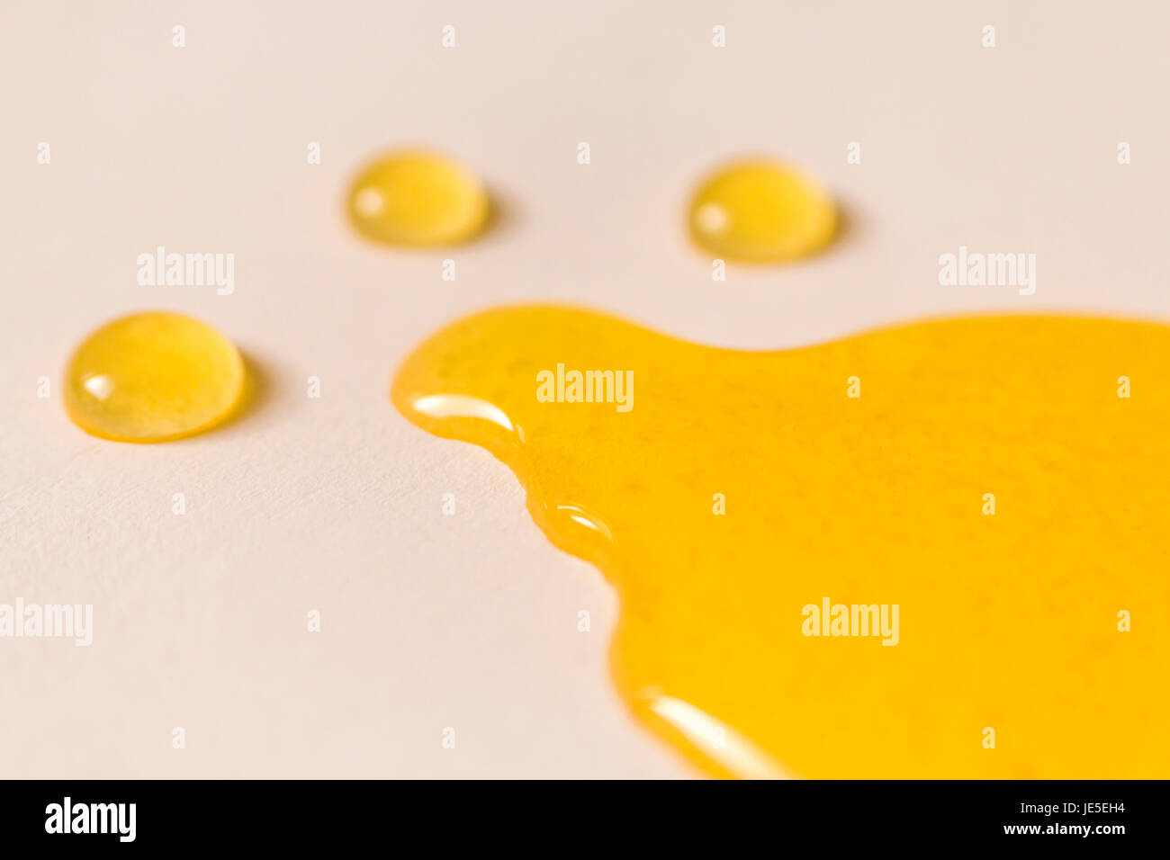 melting honey and drops on white background Stock Photo Alamy
