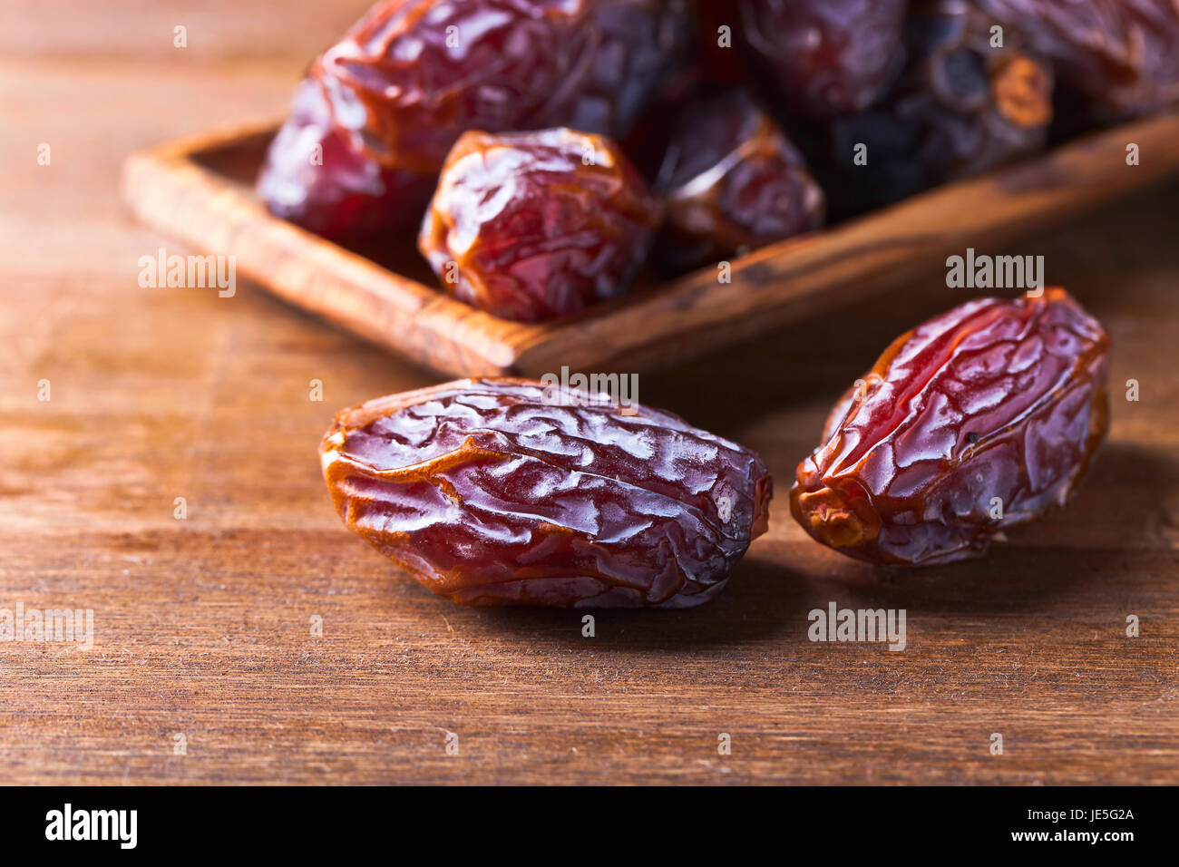 Over Ripe Dates Juicy dates on old wooden hi-res stock photography and images - Alamy