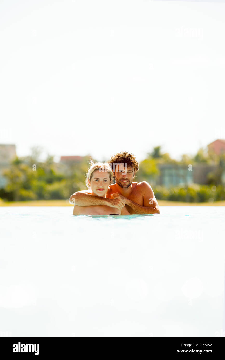 Couple relaxing together in lake Stock Photo