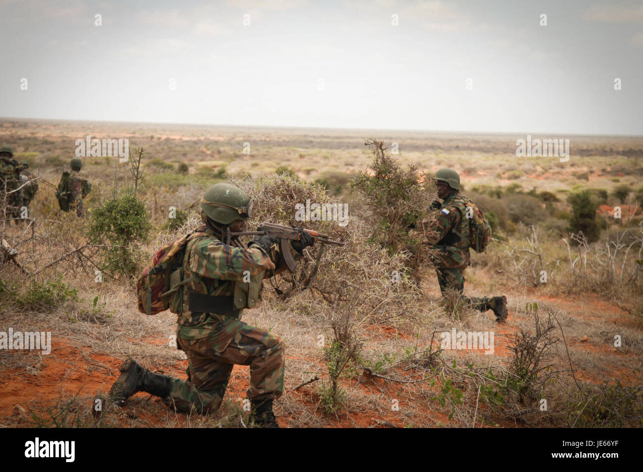 This image from September 26, 2013, shows a foot patrol unit, likely part of a law enforcement or military group. The photo captures the officers in action, moving through an urban or rural environment, performing security operations. Stock Photo