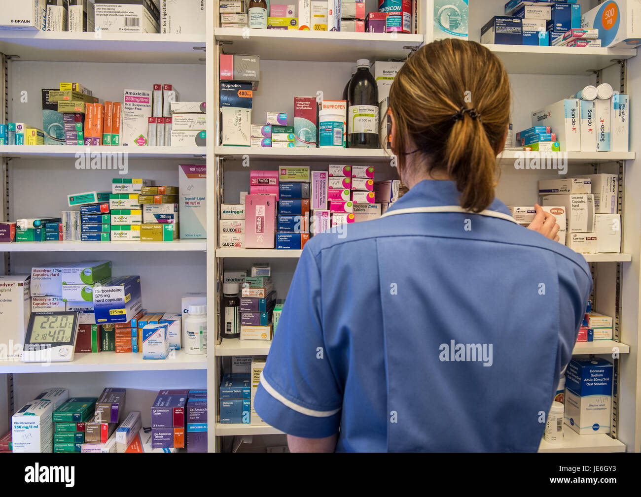 Copyrighted Image by Paul Slater/PSI - A nurse choosing medicine. Stock Photo