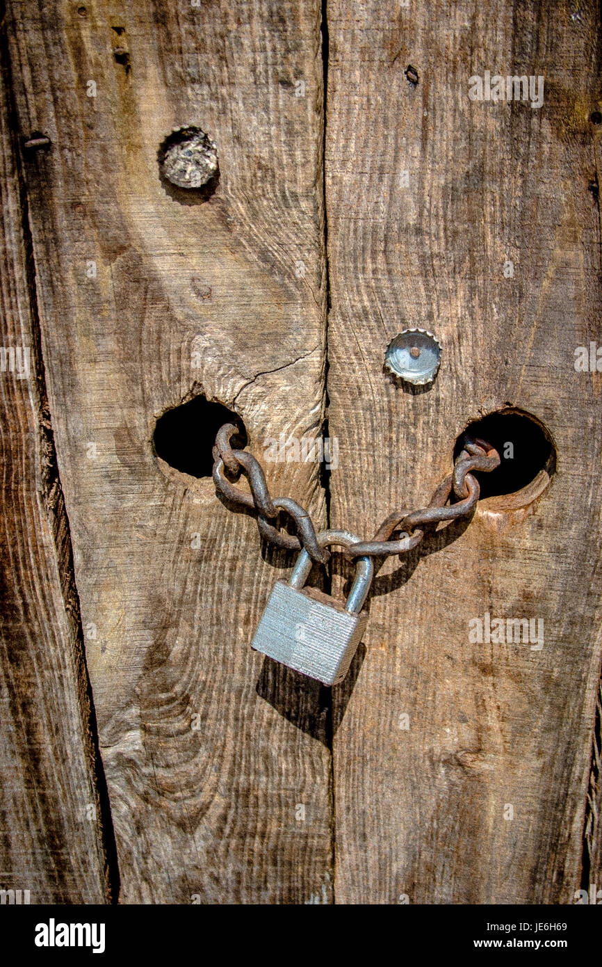 wooden door padlock security protection hacking  Stock Photo