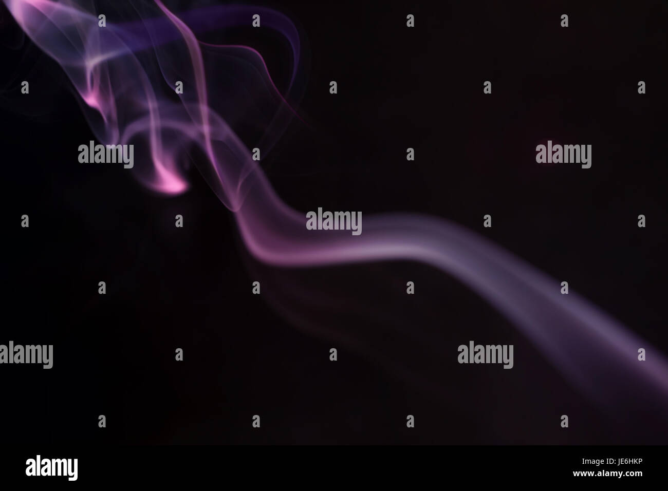 Abstract colorful smoke on a black background Stock Photo - Alamy