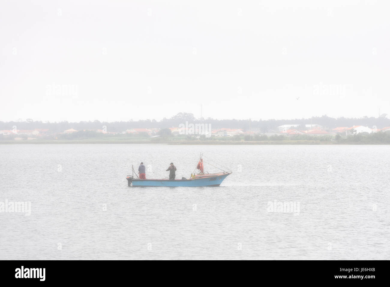Fishermen at the Aveiro river. Portugal Stock Photo