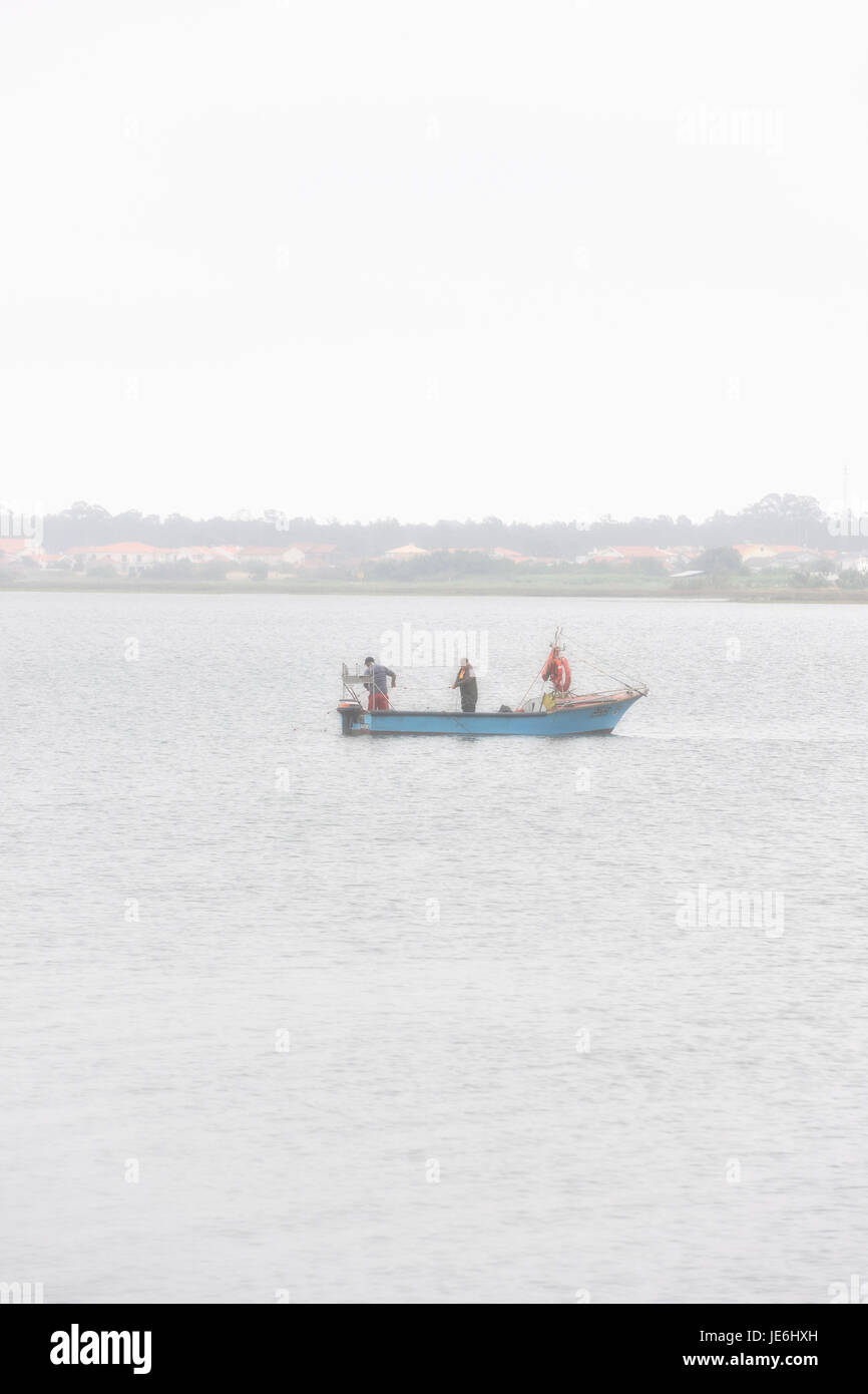 Fishermen at the Aveiro river. Portugal Stock Photo