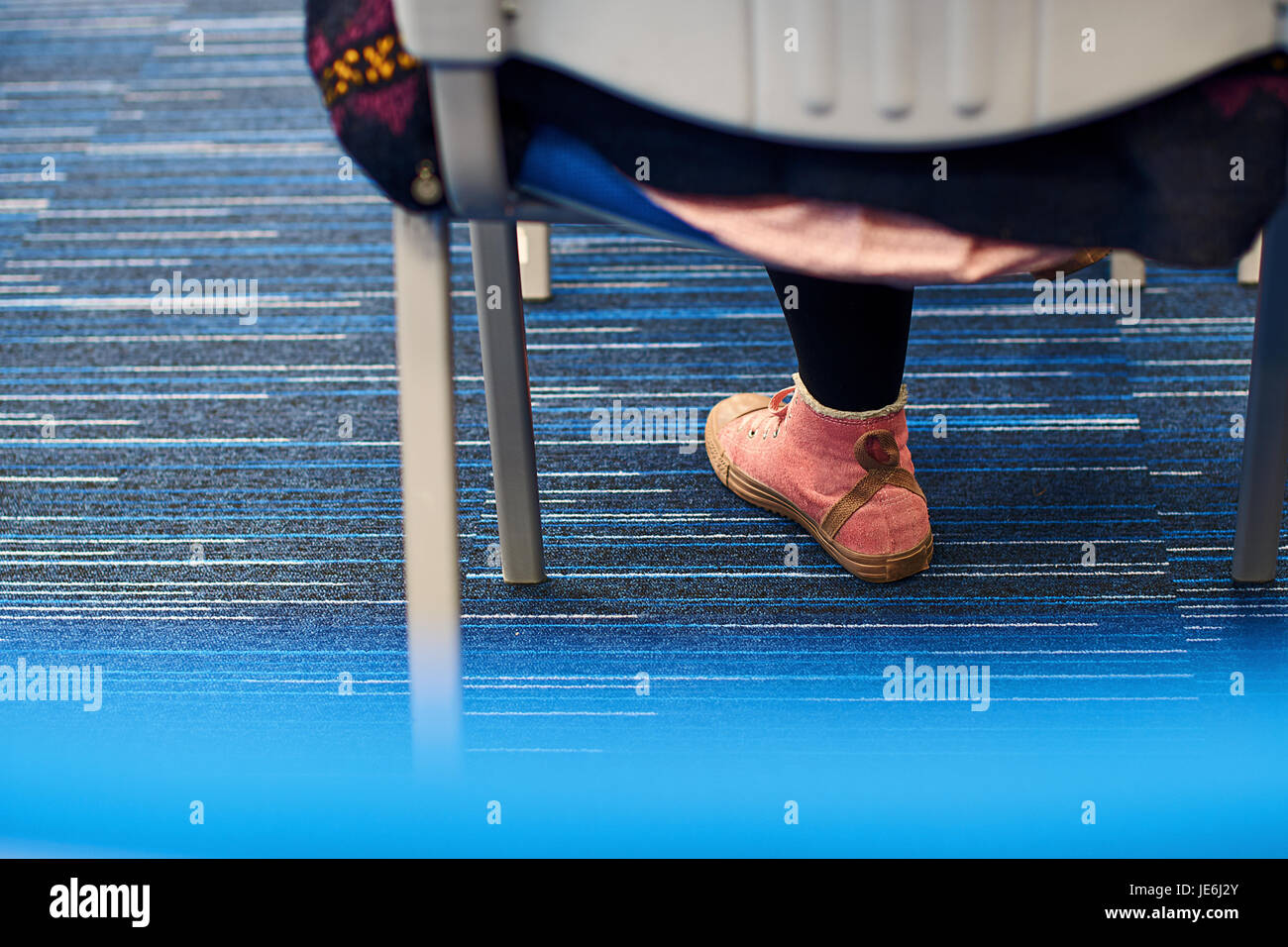 Conference participant in pink sneakers Stock Photo