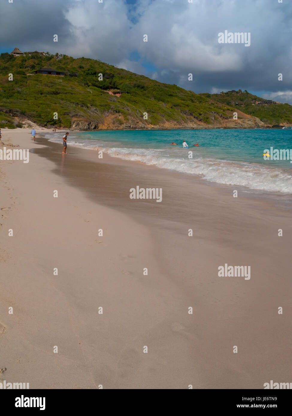 Macaroni Beach on Mustique has pristine white sands and azure blue water Stock Photo Alamy