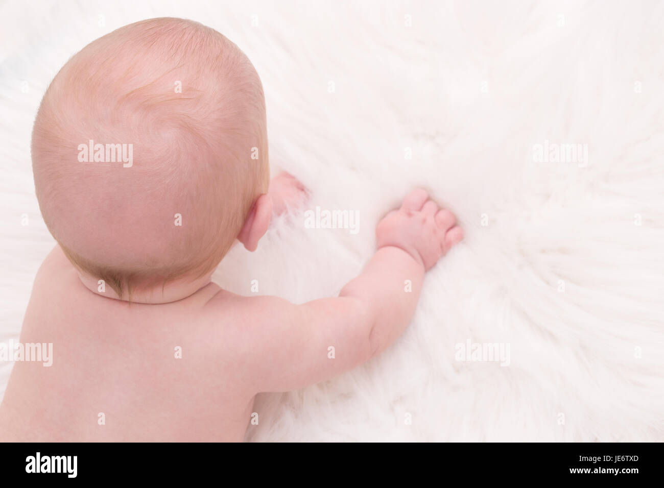 Boy facing backwards hi-res stock photography and images - Alamy