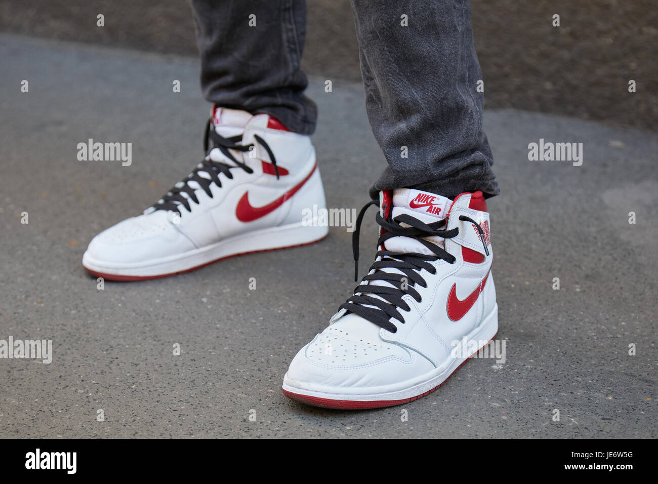 MILAN - JUNE 17: Man with white and red Nike air sneakers before Les Hommes  fashion show, Milan Fashion Week street style on June 17, 2017 in Milan  Stock Photo - Alamy