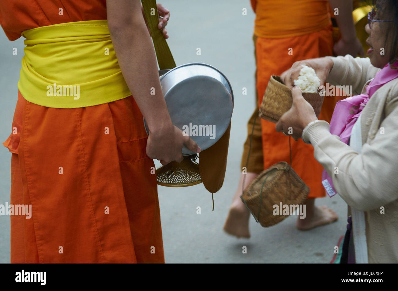 Laos, province of Luang Prabang, city of Luang Prabang, Buddhist monks collect alms and rice, Stock Photo