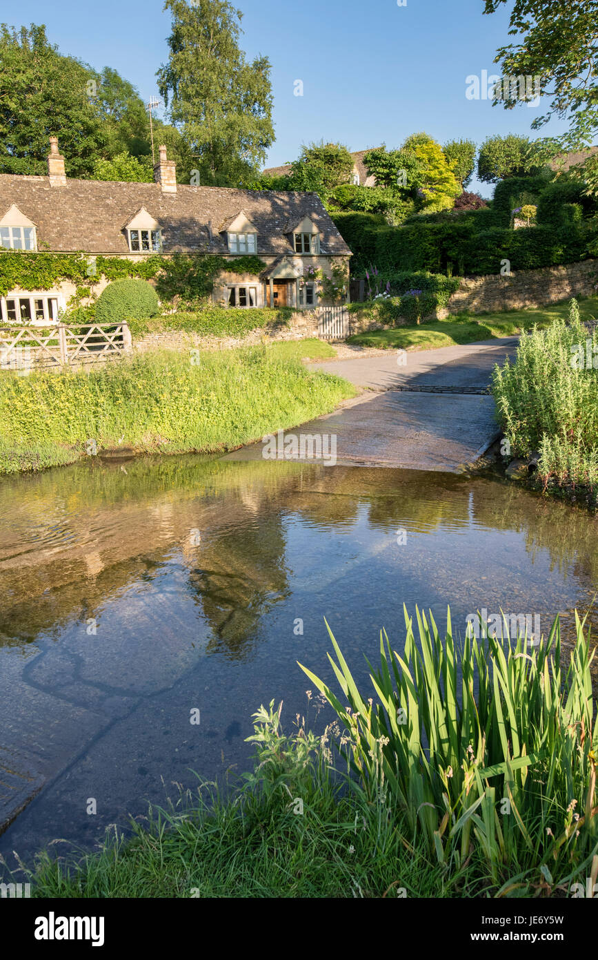River eye ford in Upper Slaughter in the late evening june sunshine. Cotswolds, Gloucestershire, England Stock Photo