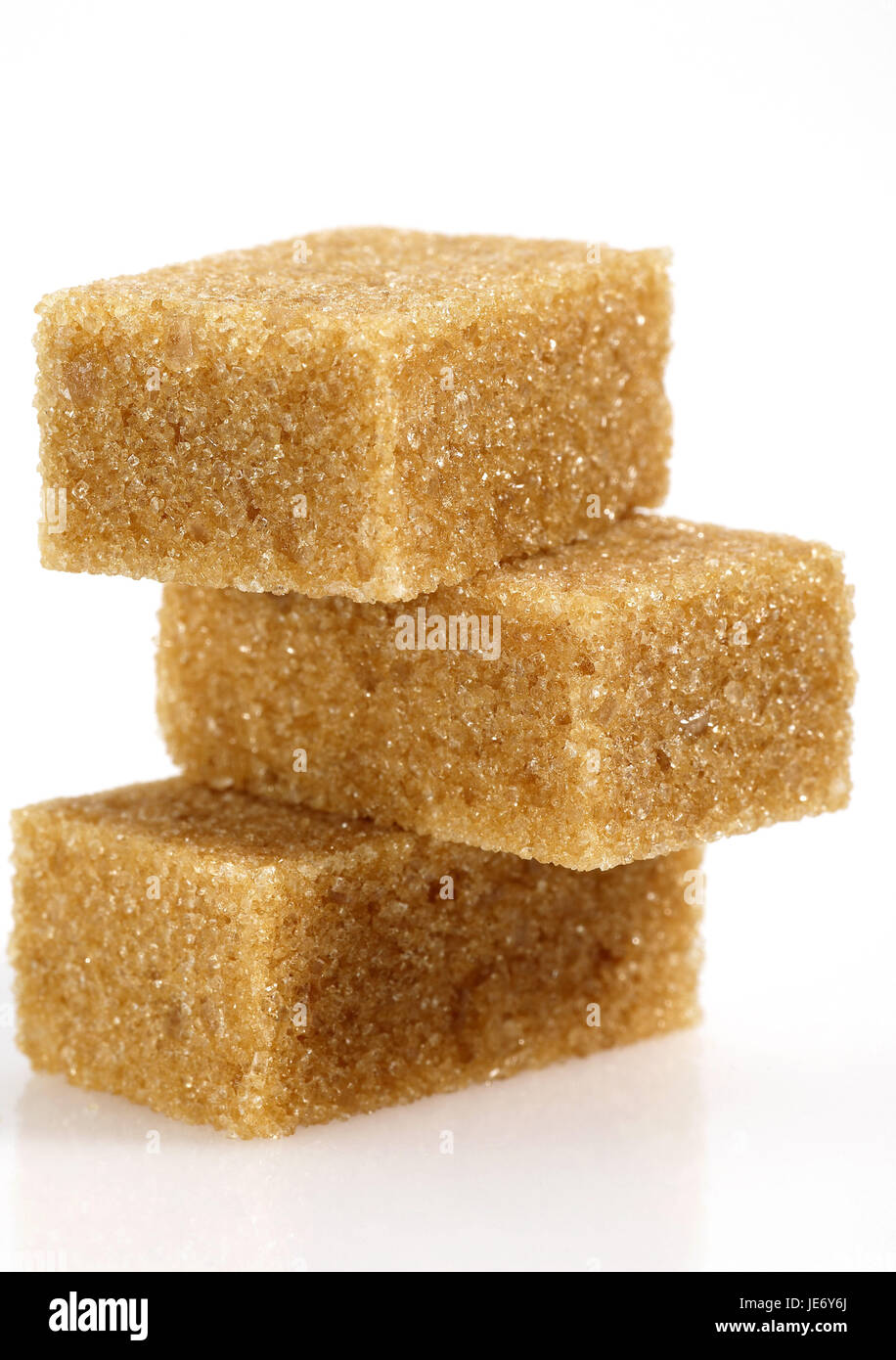 Brown sugar, cube, white background Stock Photo Alamy