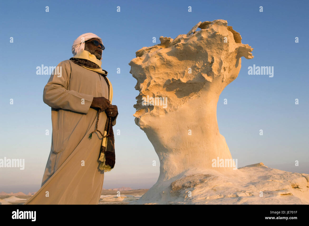 Africa, Egypt, Libyan desert, white desert, local before a stone pillar, Stock Photo