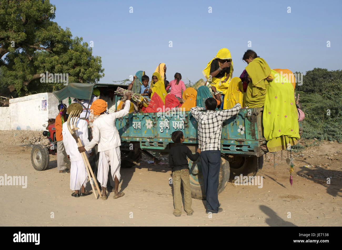 India, Rajasthan, Pushkar, person on the loading area of a vehicle, Stock Photo