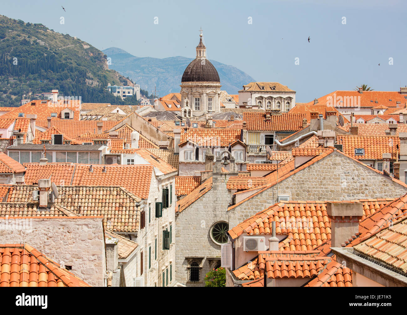 View from the massive defensive walls enclosing the beautiful red roofed medieval city of Dubrovnik on the Dalmation coast of Croatia Stock Photo