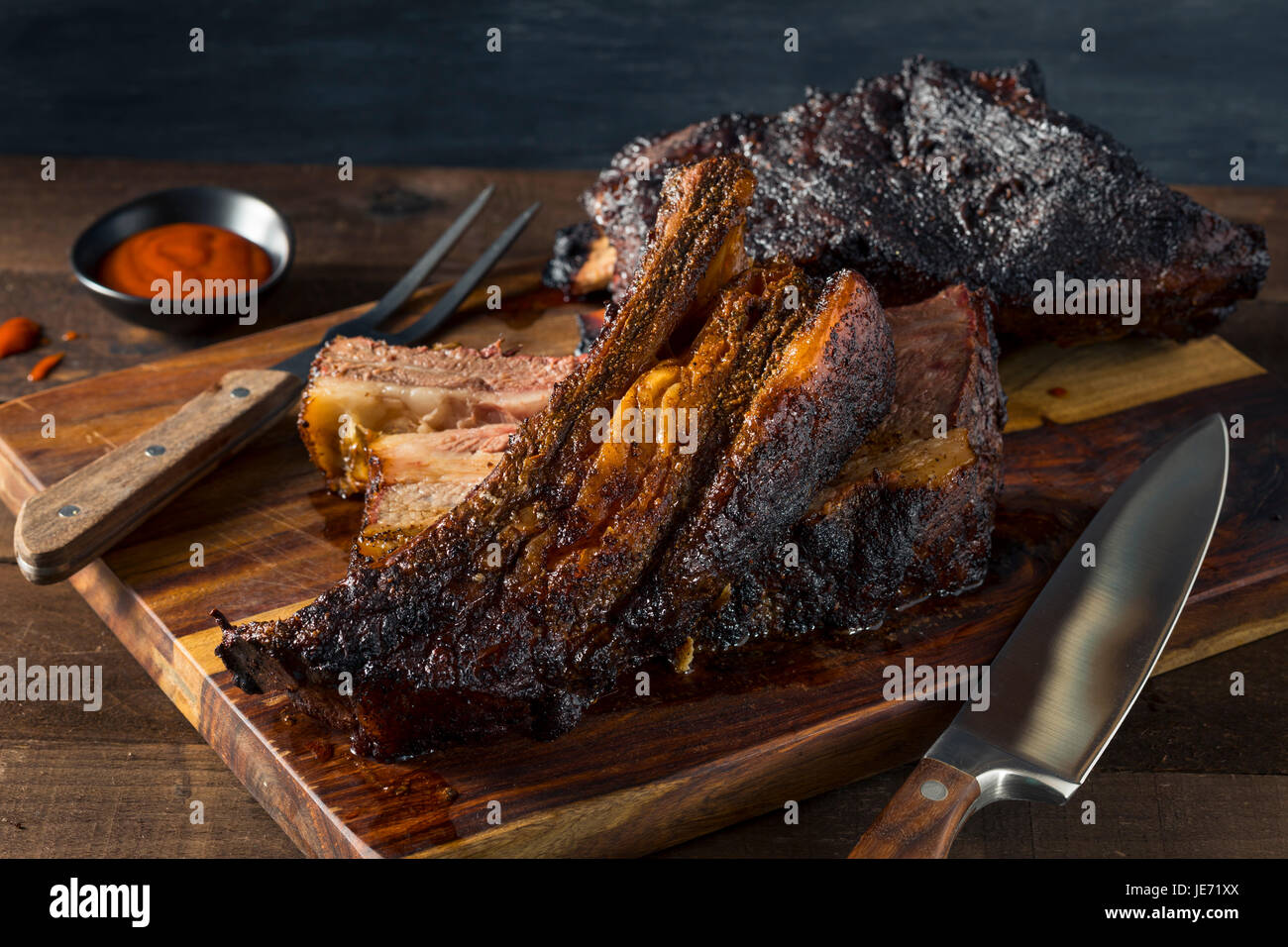 Delicious Smoked Beef Ribs with Barbecue Sauce Stock Photo