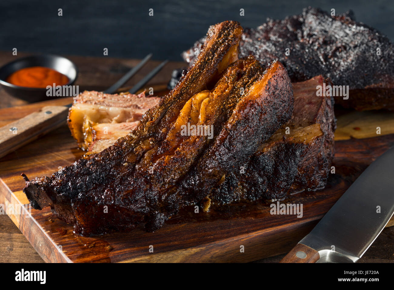 Delicious Smoked Beef Ribs with Barbecue Sauce Stock Photo