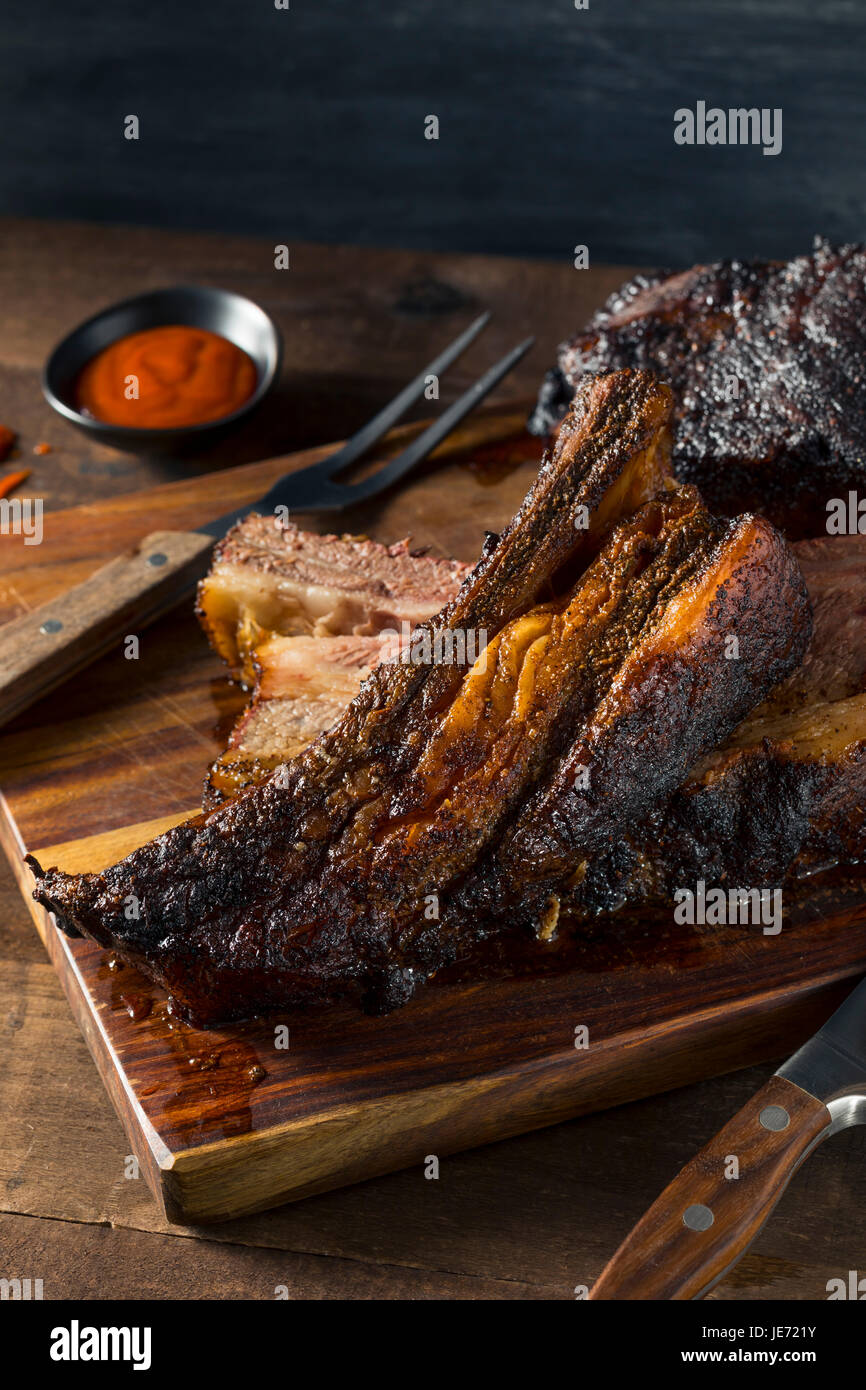 Delicious Smoked Beef Ribs with Barbecue Sauce Stock Photo