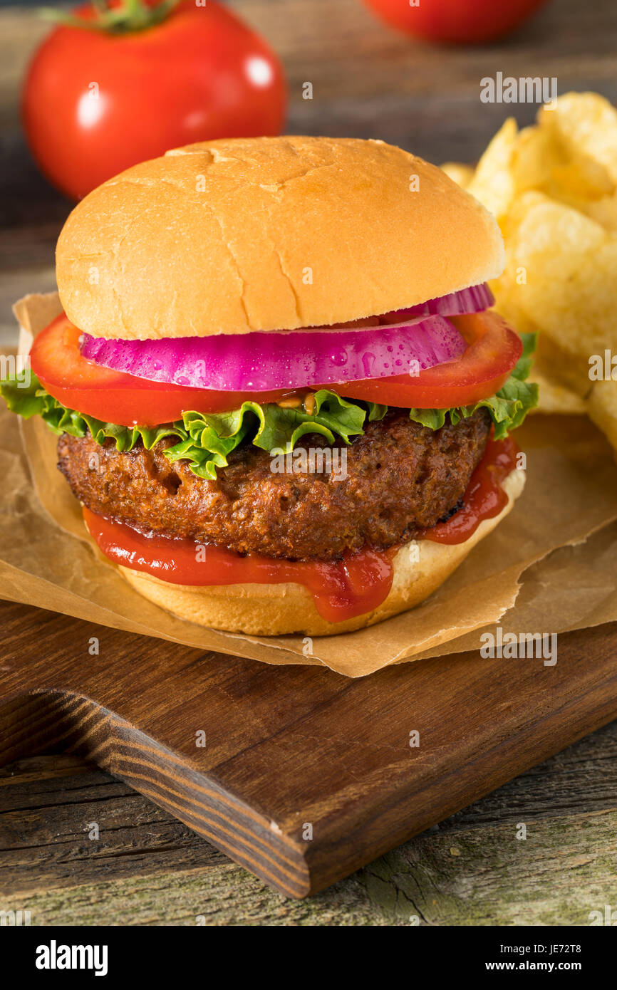 Healthy Vegan Vegetarian Meat Free Burger with Lettuce Tomato and Onion Stock Photo