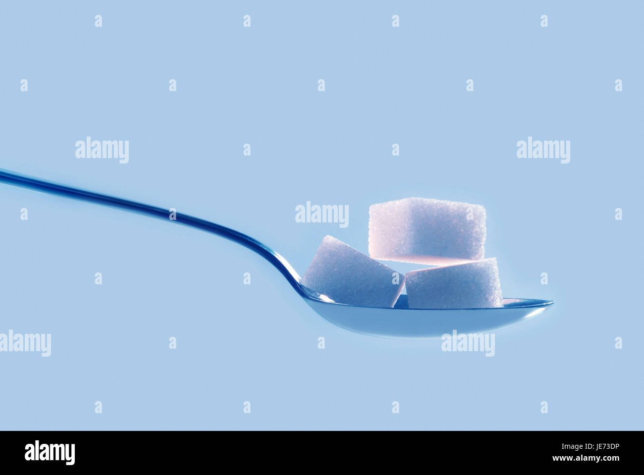 Spoon, sugar cube Stock Photo Alamy