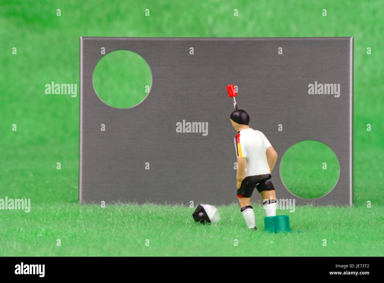 Tip kick game, goal wall with ball and player Stock Photo - Alamy
