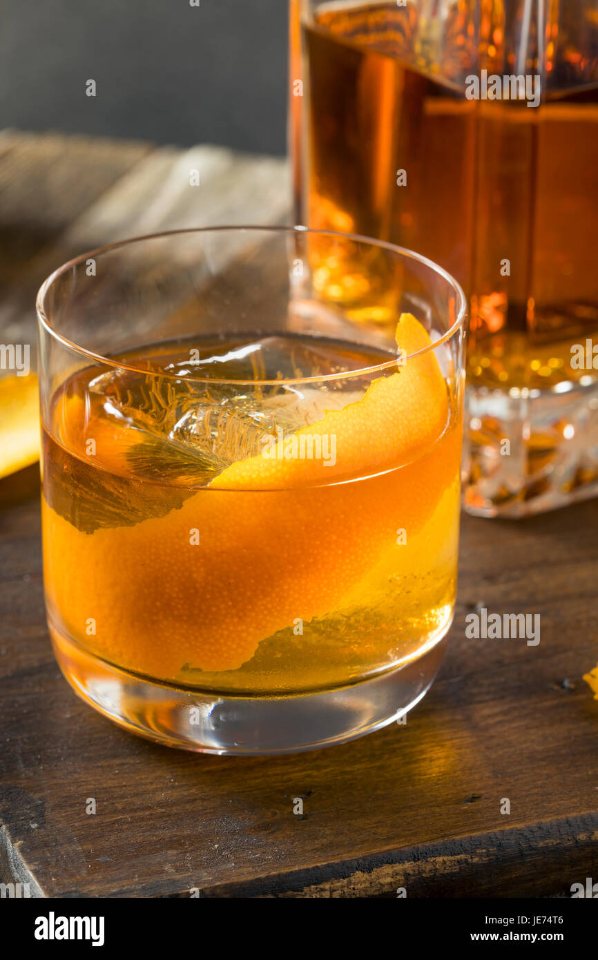 Cold Alcoholic Old Fashioned Bourbon Whiskey Cocktail with Orange