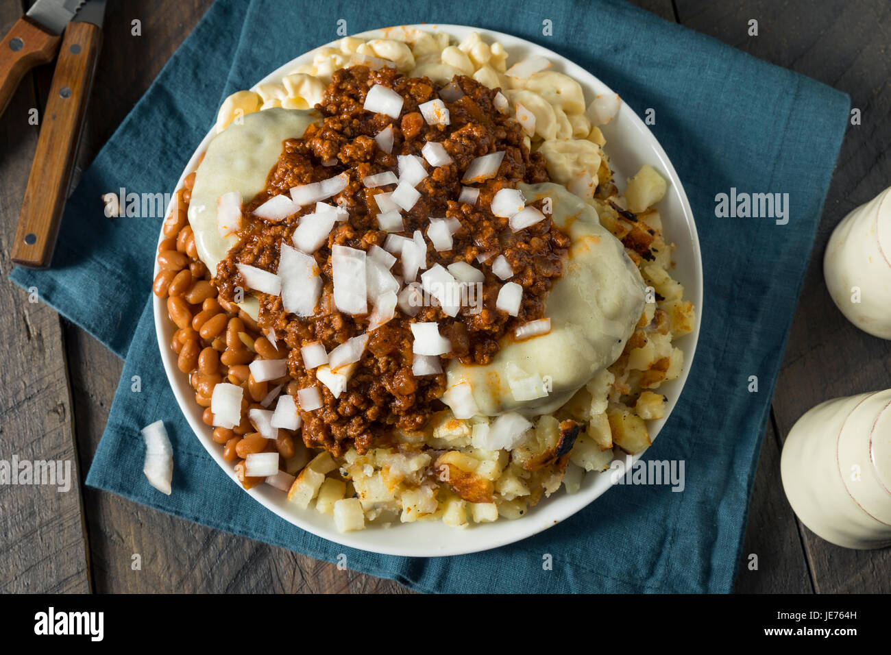Unhealthy Homemade Beef Garbage Trash Plate with Potatoes Beans