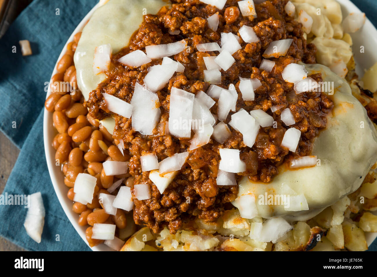 Unhealthy Homemade Beef Garbage Trash Plate with Potatoes Beans