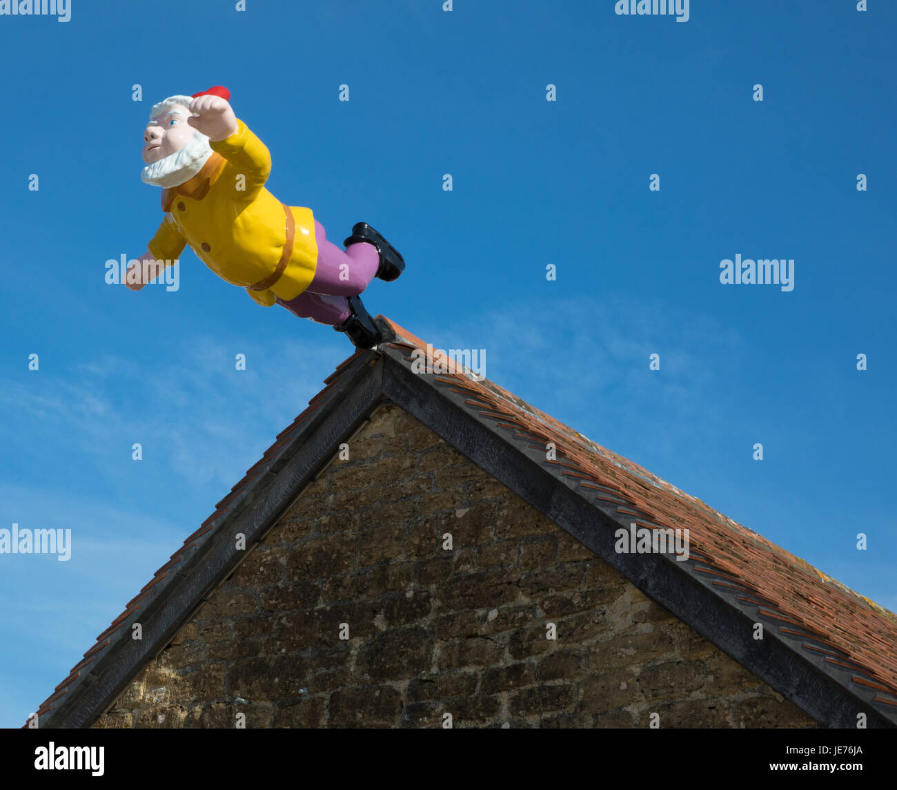 Leaping Gnome sculpture by Serbian artist Djordje Ozbolt greeting visitors to the Hauser and Wirth gallery at Bruton in Somerset UK Stock Photo