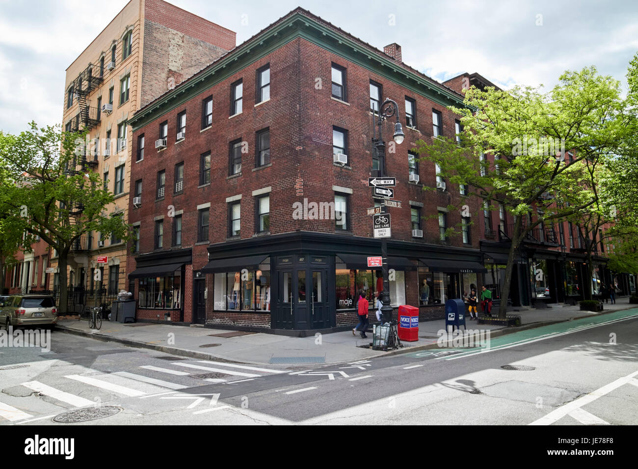 4-story red brick residential building on the corner of bleeker street and bank st greenwich village New York City USA Stock Photo