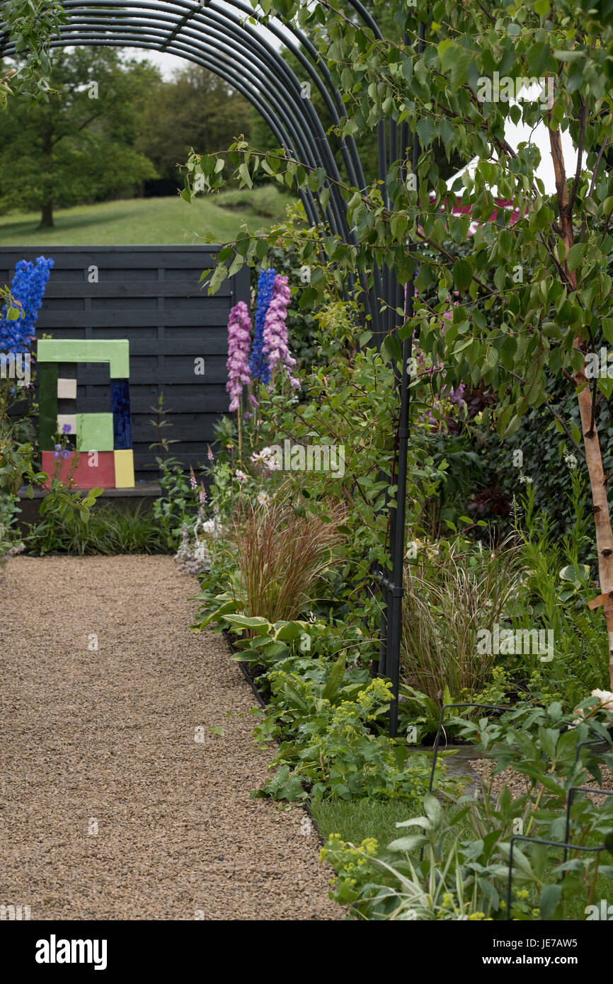 Path & border in Modernist & Bauhaus inspired Agriframes Garden at first RHS Chatsworth Flower Show -  Chatsworth House, Derbyshire, England, UK. Stock Photo