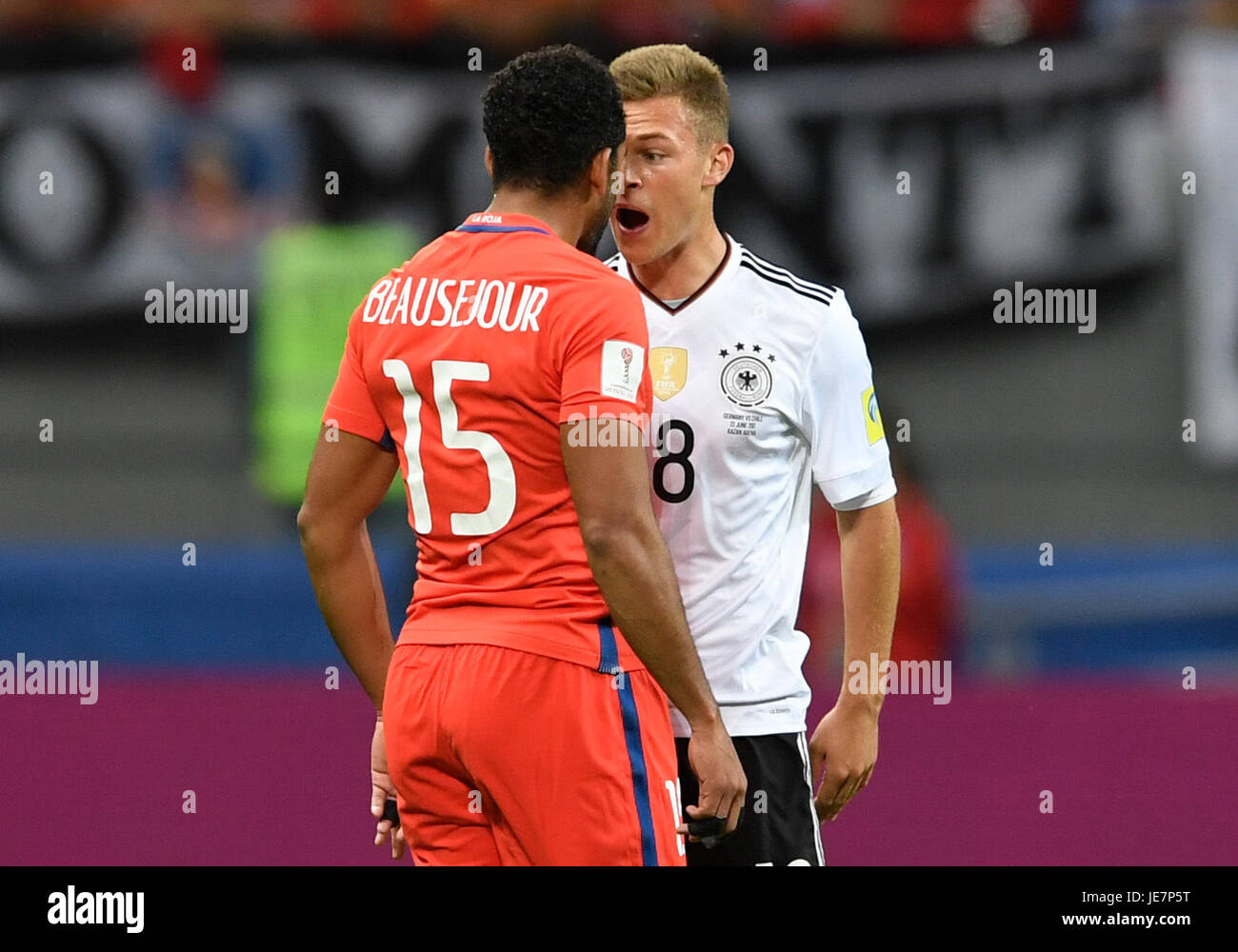 Kazan, Russia. 22nd June, 2017. Germany's Joshua Kimmich (R) and Chile's Jean Beausejour argue on the pitch during the Group B preliminary stage soccer match between Chile and Germany at the Confederations Cup in Kazan, Russia, 22 June 2017. Photo: Marius Becker/dpa/Alamy Live News Stock Photo