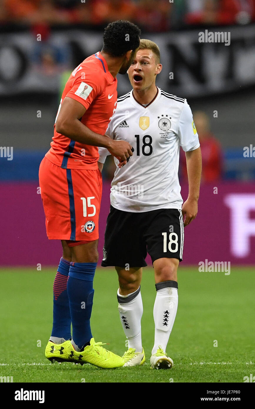 Kazan, Russia. 22nd June, 2017. Germany's Joshua Kimmich (R) and Chile's Jean Beausejour argue on the pitch during the Group B preliminary stage soccer match between Chile and Germany at the Confederations Cup in Kazan, Russia, 22 June 2017. Photo: Marius Becker/dpa/Alamy Live News Stock Photo