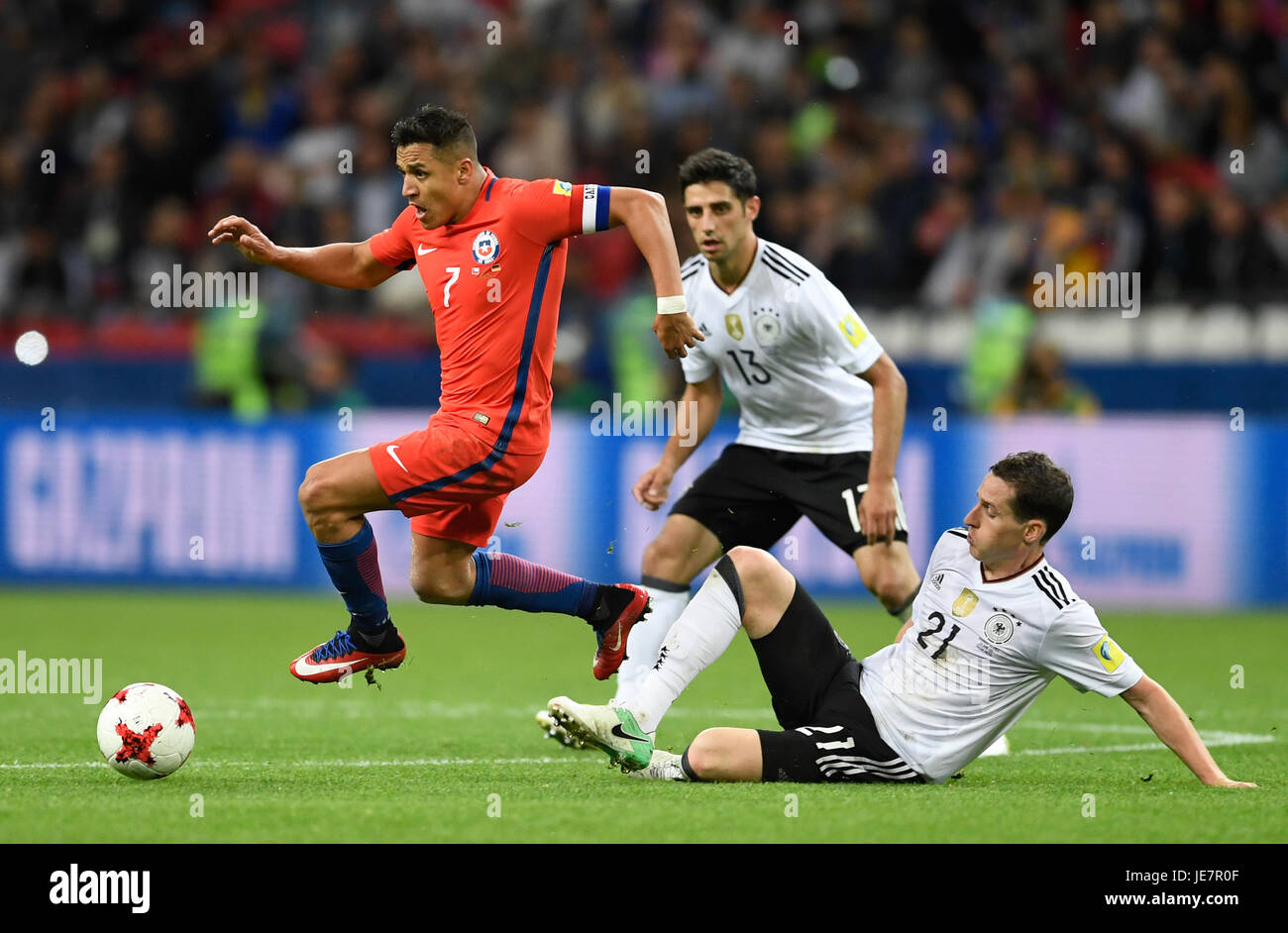 Kazan, Russia. 22nd June, 2017. Germany's Sebastian Rudy (R) and Lars Stindlvie for the ball with Chile's Alexis Sanchez (L) during the Group B preliminary stage soccer match between Chile and Germany at the Confederations Cup in Kazan, Russia, 22 June 2017. Photo: Marius Becker/dpa/Alamy Live News Stock Photo