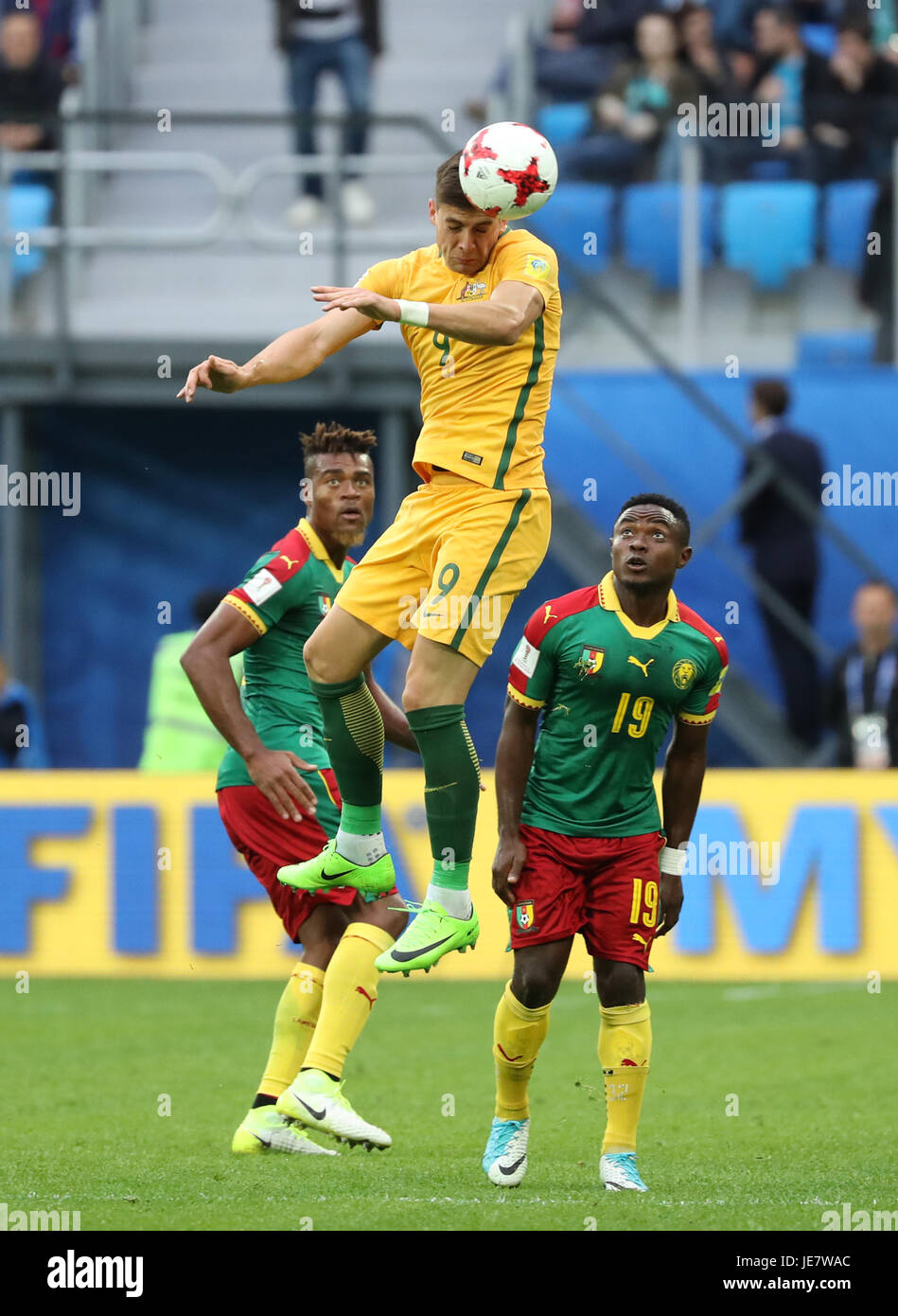 St. Petersburg, Russia. 22nd June, 2017. Tomi Juric (C) of Australia heads the ball during the group B match between Cameroon and Australia at the 2017 FIFA Confederations Cup in St. Petersburg, Russia, on June 22, 2017. The match ended with a 1-1 draw. Credit: Xu Zijian/Xinhua/Alamy Live News Stock Photo