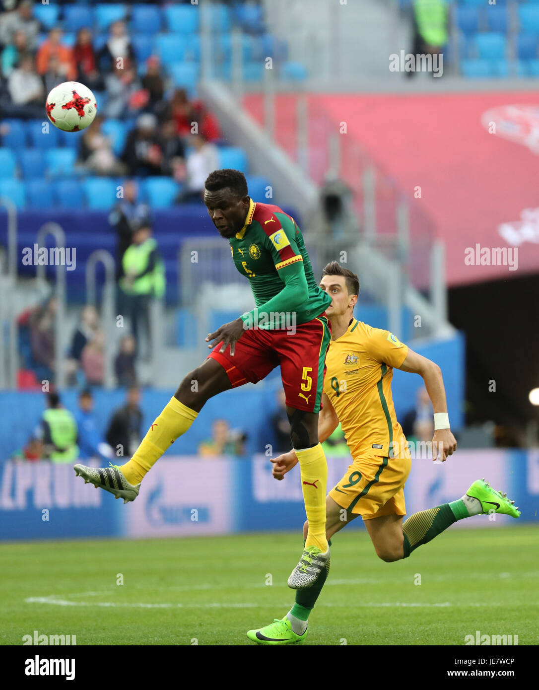 St. Petersburg, Russia. 22nd June, 2017. Michael Ngadeu-Ngadjui (L) of Cameroon vies with Tomi Juric of Australia during the group B match between Cameroon and Australia at the 2017 FIFA Confederations Cup in St. Petersburg, Russia, on June 22, 2017. The match ended with a 1-1 draw. Credit: Xu Zijian/Xinhua/Alamy Live News Stock Photo