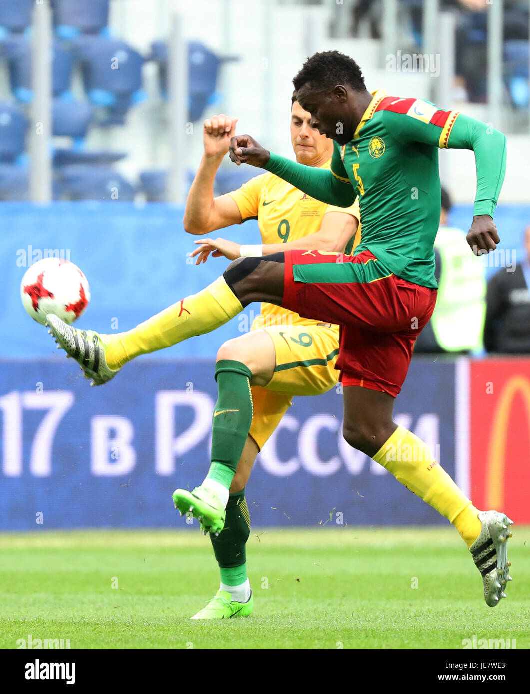 St. Petersburg, Russia. 22nd June, 2017. Michael Ngadeu-Ngadjui (R) of Cameroon vies with Tomi Juric of Australia during the group B match between Cameroon and Australia at the 2017 FIFA Confederations Cup in St. Petersburg, Russia, on June 22, 2017. The match ended with a 1-1 draw. Credit: Xu Zijian/Xinhua/Alamy Live News Stock Photo