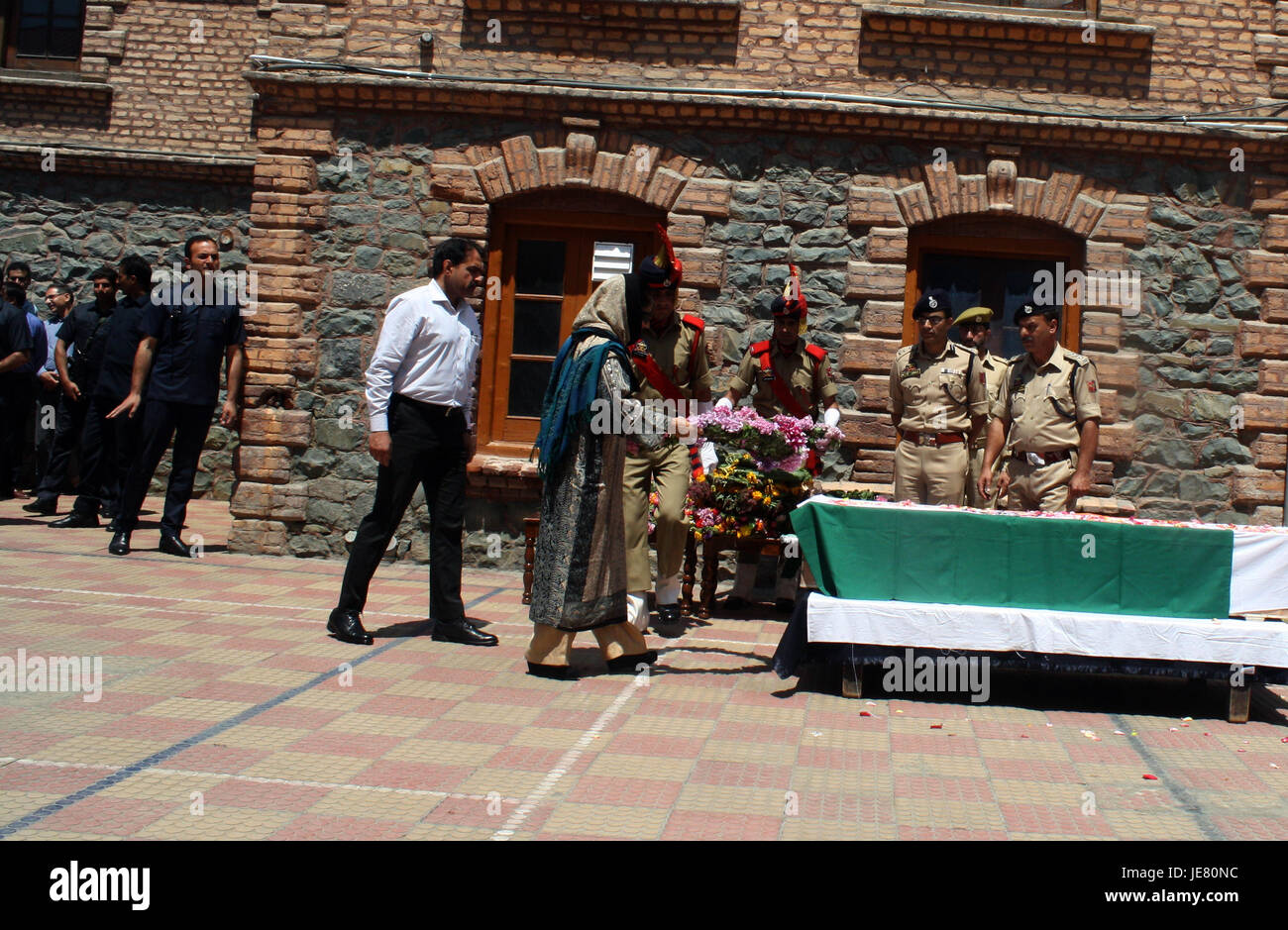 Srinagar, Kashmir. 23rd June, 2017. Jammu and Kashmir Chief Minister Mehbooba Mufti floral tributes at District police lines.during the Wreath laying ceremony of Deputy SP Mohammed Ayub Pandith of Security beaten to death by mob.He was allegedly clicking pictures of people while they were coming out of the mosque. They said people tried to catch Pandit who allegedly fired several shots from his pistol, injuring three persons.on the eve of Muslims across Kashmir are observing Shab-e-Qadr (the night).outside the Grand mosque in down town area of srinagar. © Sofi Suhail/Alamy Live News Stock Photo
